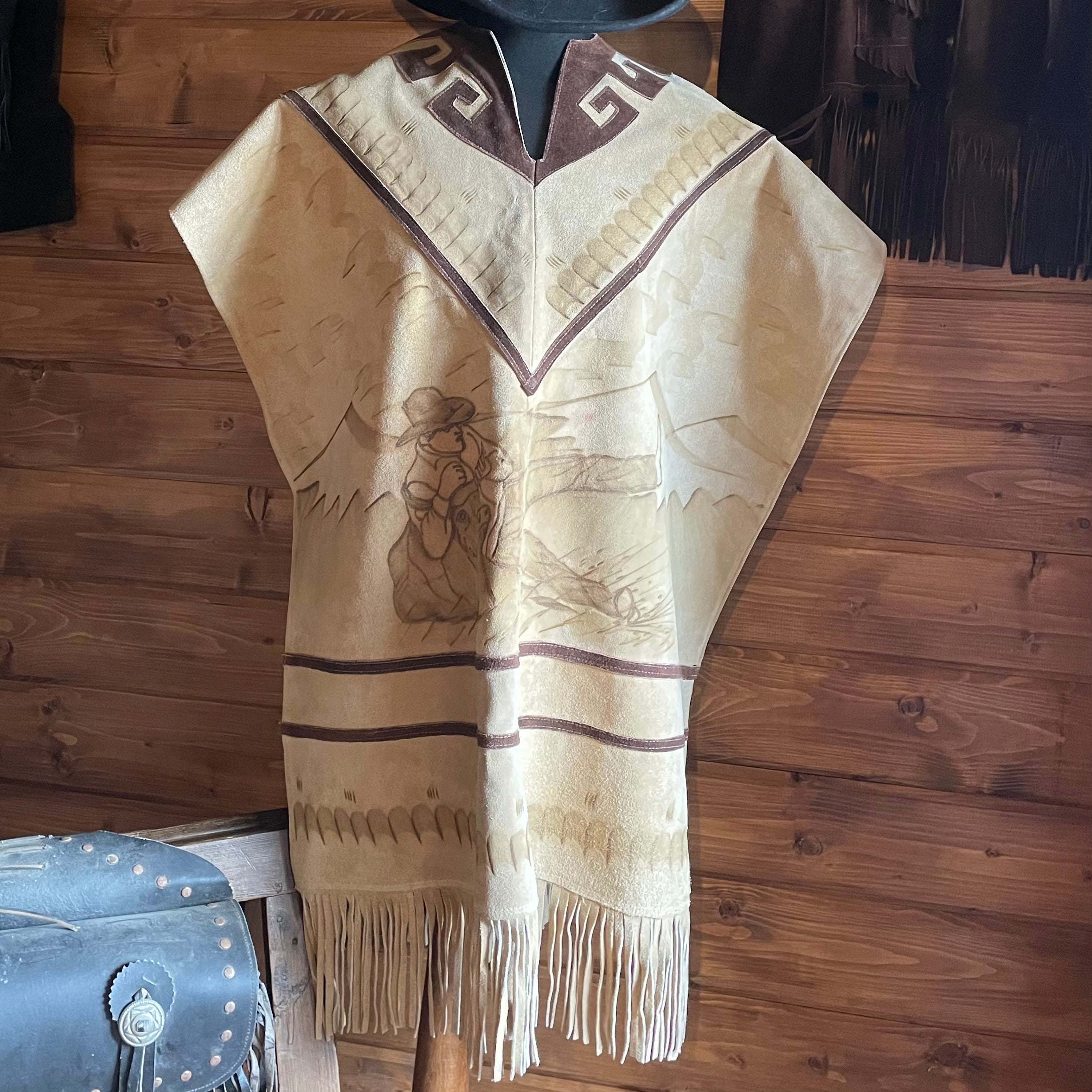 Authentic Mexican sued Poncho with embossed art work